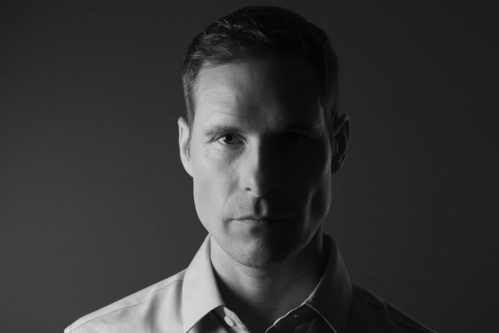 black and white head shot of a man