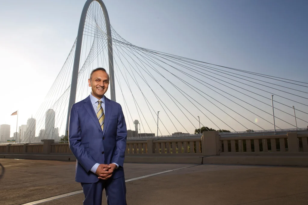 Surgeon in suit standing at Hunt Hill Bridge in downtown Dallas | Services |