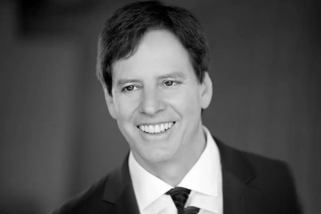 Smiling Man in a Suit and Tie Black and White Portrait Head and Shoulders